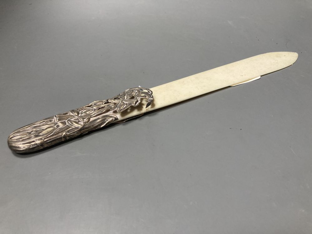 A Chinese? pierced white metal mounted ivory paper knife (a.f.), 33.6cm.
